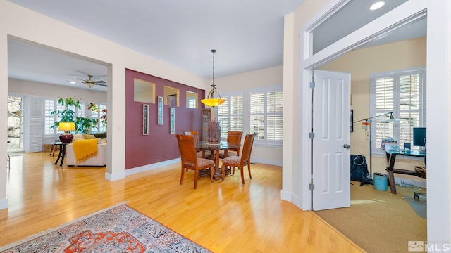4940 Turning Leaf Way, Reno, NV 89519 - dining area with wood finished floors, a ceiling fan, and plenty of natural light