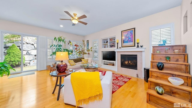 4940 Turning Leaf Way, Reno, NV 89519 - living room featuring ceiling fan, a fireplace, wood finished floors, and recessed lighting