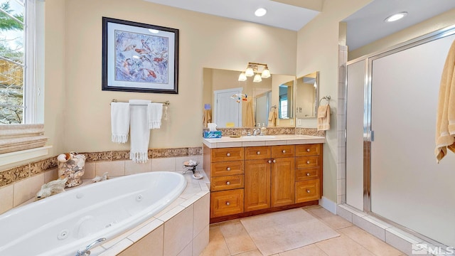4940 Turning Leaf Way, Reno, NV 89519 - bathroom featuring a shower stall, vanity, a whirlpool tub, and tile patterned flooring