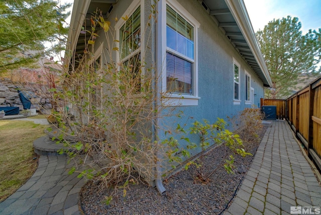 4940 Turning Leaf Way, Reno, NV 89519 - view of side of home with stucco siding and a fenced backyard