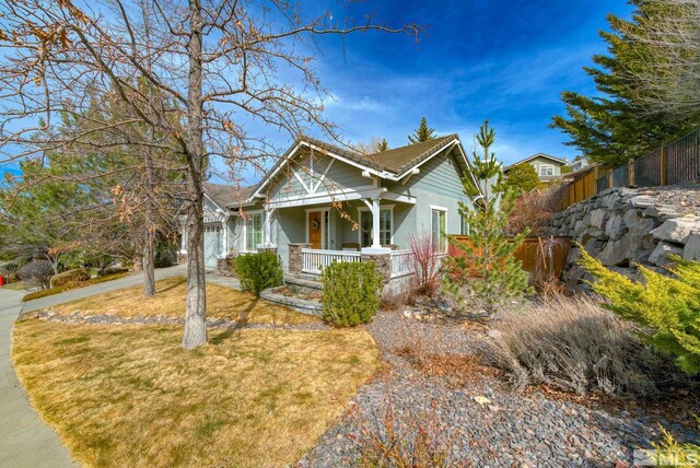 4940 Turning Leaf Way, Reno, NV 89519 - view of front of home with a porch, stucco siding, and driveway