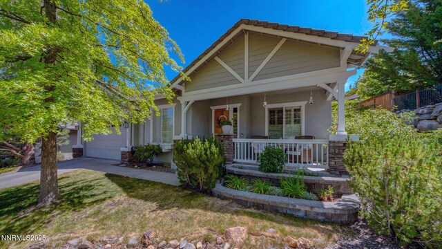 4940 Turning Leaf Way, Reno, NV 89519 - craftsman house with a porch, an attached garage, stucco siding, and concrete driveway