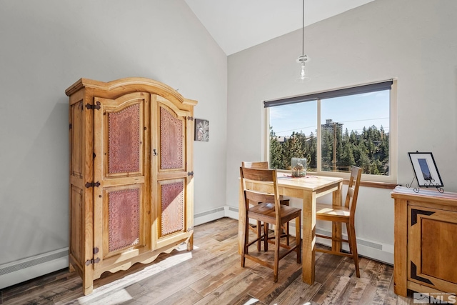 396 Tramway Dr # 3, Stateline, NV 89449 - dining area featuring high vaulted ceiling, light wood-type flooring, and a baseboard radiator