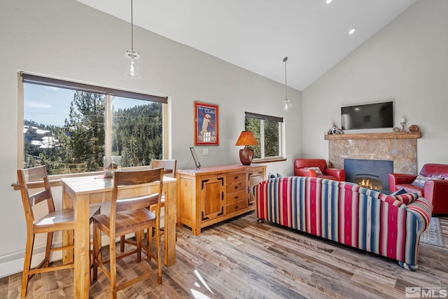 396 Tramway Dr # 3, Stateline, NV 89449 - dining space featuring high vaulted ceiling, a high end fireplace, wood finished floors, and recessed lighting