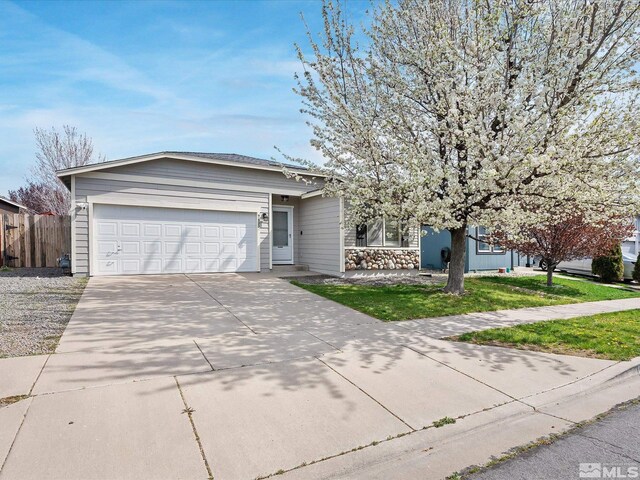 7433 Gannon Dr, Reno, NV 89506 - view of front of house featuring driveway and an attached garage