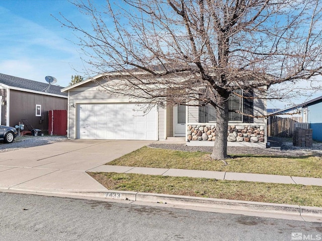 7433 Gannon Dr, Reno, NV 89506 - view of front facade featuring concrete driveway, an attached garage, and fence