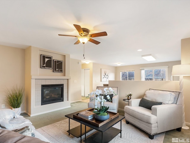 7433 Gannon Dr, Reno, NV 89506 - carpeted living room featuring a ceiling fan, baseboards, and a fireplace