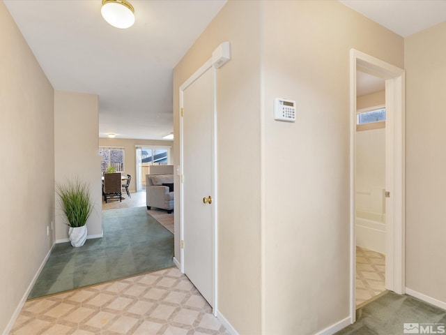 7433 Gannon Dr, Reno, NV 89506 - corridor featuring light carpet and baseboards