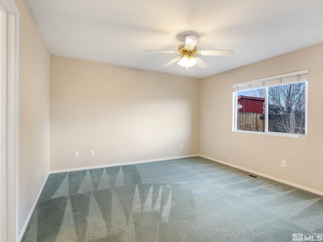 7433 Gannon Dr, Reno, NV 89506 - unfurnished room featuring dark carpet, ceiling fan, and baseboards