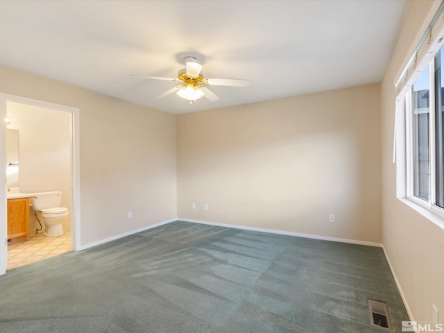 7433 Gannon Dr, Reno, NV 89506 - carpeted empty room with a ceiling fan and baseboards