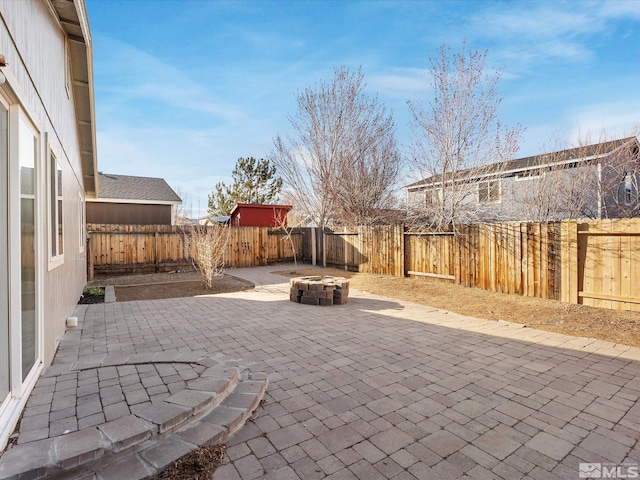 7433 Gannon Dr, Reno, NV 89506 - view of patio / terrace with a fire pit and a fenced backyard