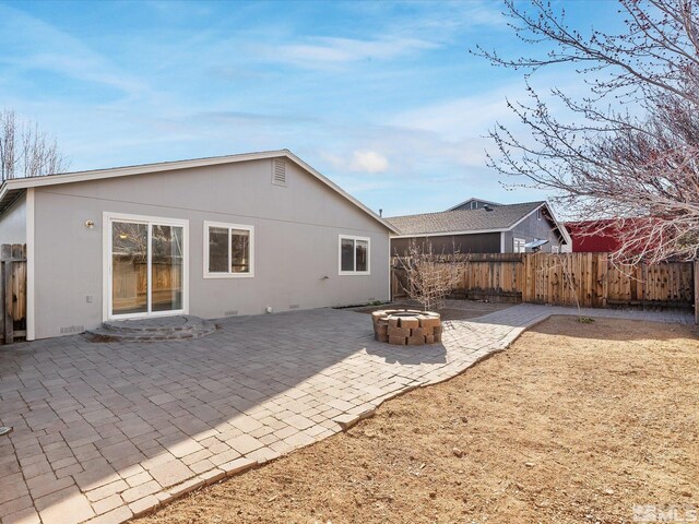 7433 Gannon Dr, Reno, NV 89506 - back of property featuring a patio, a fenced backyard, and stucco siding