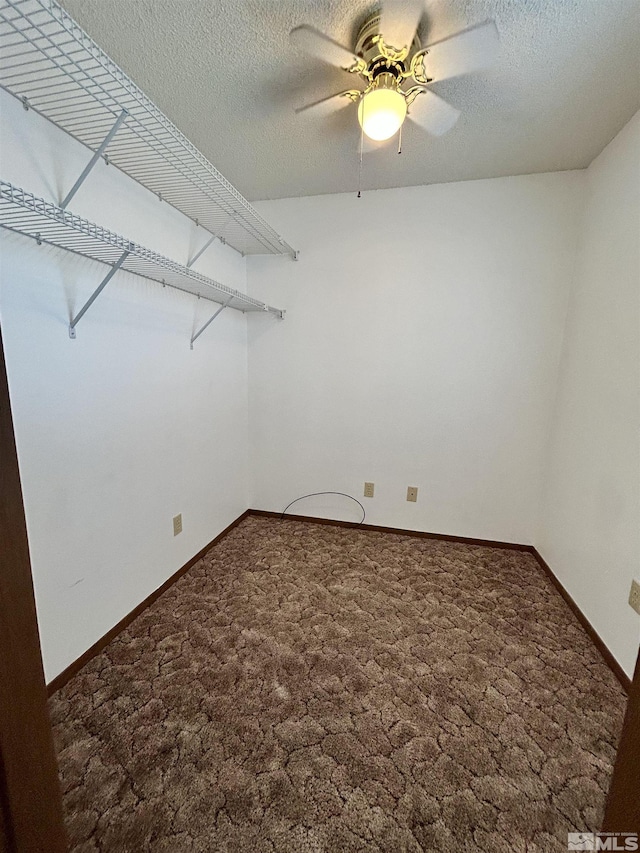 spare room with carpet, a ceiling fan, baseboards, and a textured ceiling