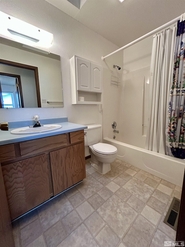 bathroom with toilet, shower / tub combo with curtain, and vanity