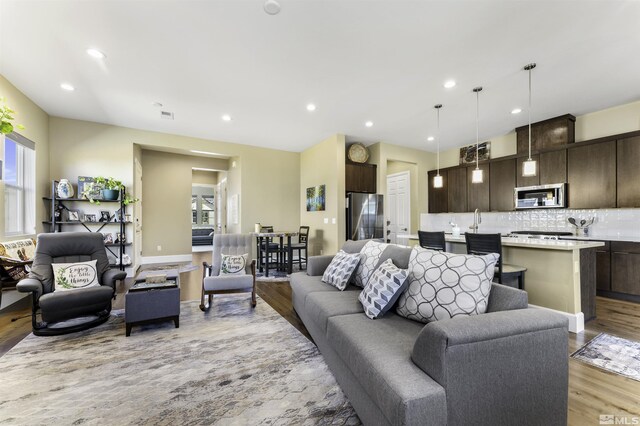 7317 Oakmont Ln, Sparks, NV 89436 - living area with light wood-style flooring and recessed lighting