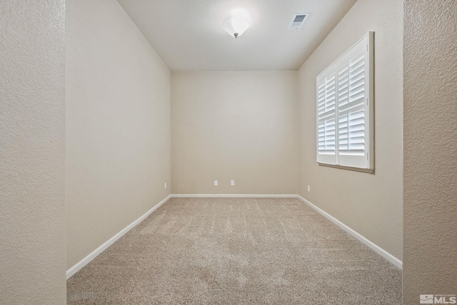 823 Gullane Ct, Dayton, NV 89403 - unfurnished room with carpet flooring, a textured wall, and baseboards