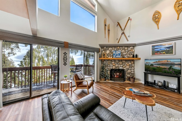 400 Fairview Blvd Unit 217, Incline Village, NV 89451 - living area featuring high vaulted ceiling, healthy amount of natural light, wood finished floors, and a fireplace