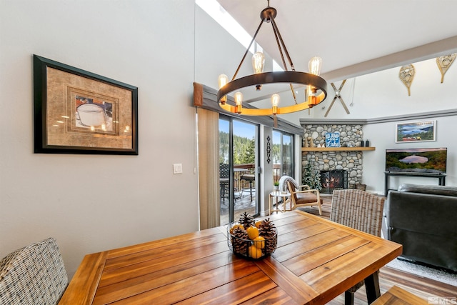 400 Fairview Blvd Unit 217, Incline Village, NV 89451 - dining area featuring a chandelier and a stone fireplace