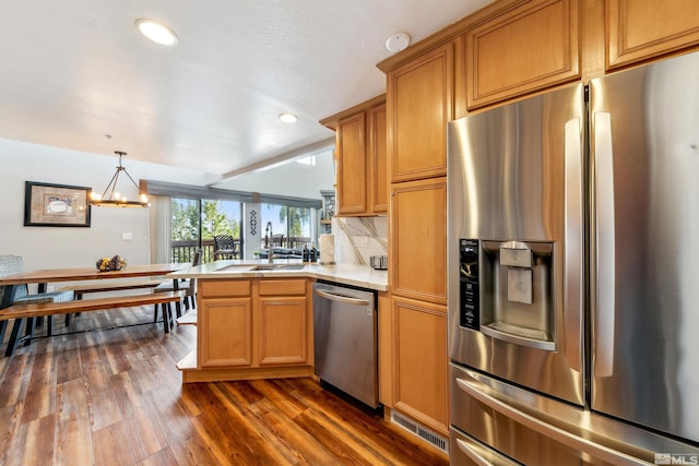 400 Fairview Blvd Unit 217, Incline Village, NV 89451 - kitchen with appliances with stainless steel finishes, dark wood finished floors, tile counters, a chandelier, and recessed lighting