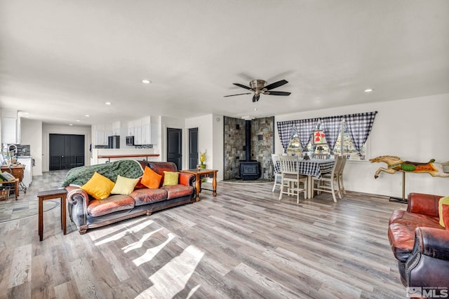 285 James Ave, Dayton, NV 89403 - living area with a wood stove, light wood-style floors, ceiling fan, and recessed lighting