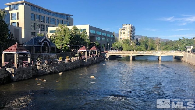 450 N Arlington Ave Unit 708, Reno, NV 89503 - water view with a notable bridge, a gazebo, and a mountainous background