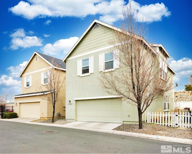 2020 Alamo Square Way, Reno, NV 89509 - traditional-style house with an attached garage, stucco siding, and fence