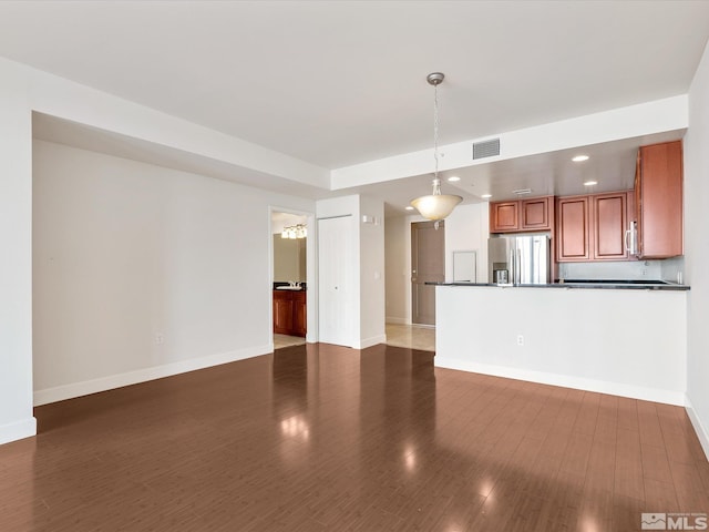 50 N Sierra Unit 605, Reno, NV 89501 - unfurnished living room featuring baseboards, recessed lighting, and dark wood finished floors