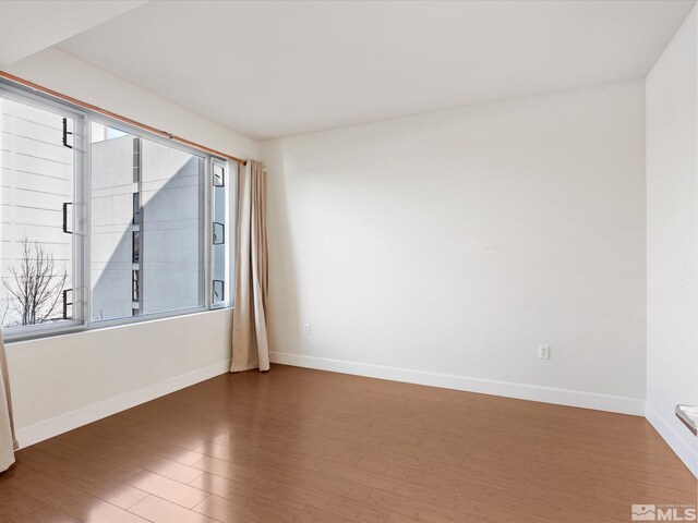 50 N Sierra Unit 605, Reno, NV 89501 - empty room with wood finished floors and baseboards