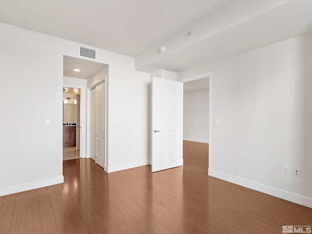 50 N Sierra Unit 605, Reno, NV 89501 - spare room featuring baseboards and wood finished floors