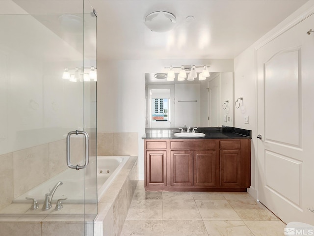 50 N Sierra Unit 605, Reno, NV 89501 - full bath featuring a tub with jets, vanity, and a shower stall