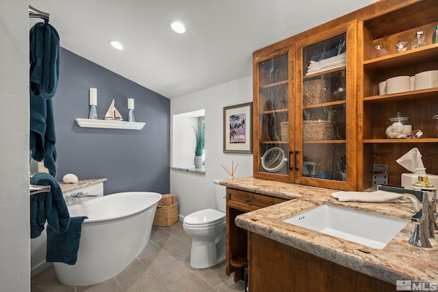 1005 Marlene St, Incline Village, NV 89451 - bathroom with a freestanding tub, toilet, vanity, and vaulted ceiling