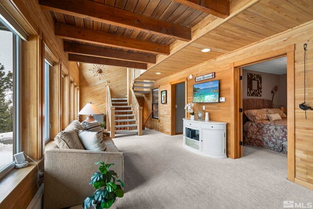 1005 Marlene St, Incline Village, NV 89451 - carpeted living room featuring wood ceiling, wood walls, and stairs