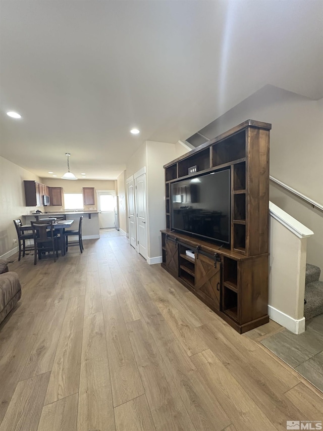 5282 Western Way, Winnemucca, NV 89445 - living area with stairway, light wood-style flooring, recessed lighting, and baseboards