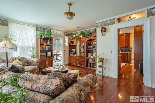 182 Mill St, Genoa, NV 89411 - living room featuring dark wood-type flooring, baseboards, and crown molding