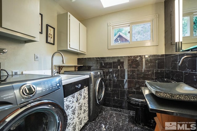 182 Mill St, Genoa, NV 89411 - washroom featuring cabinet space, marble finish floors, plenty of natural light, and washer and clothes dryer