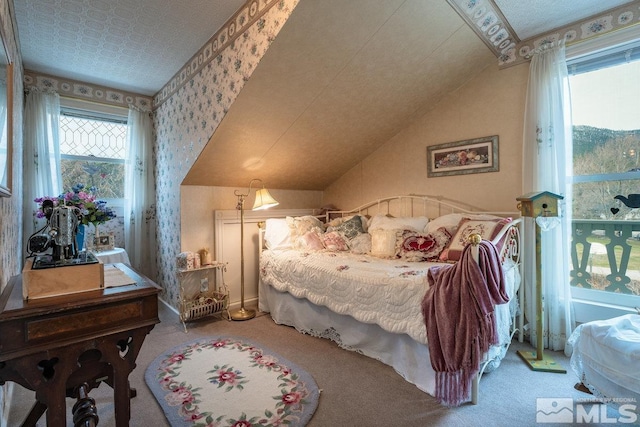 182 Mill St, Genoa, NV 89411 - carpeted bedroom featuring wallpapered walls and vaulted ceiling