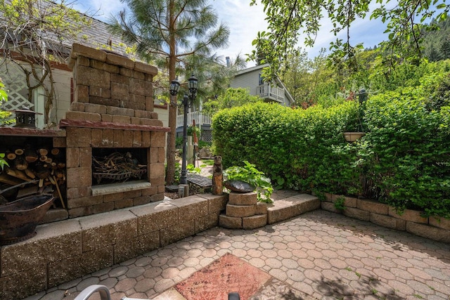 182 Mill St, Genoa, NV 89411 - view of patio featuring an outdoor stone fireplace