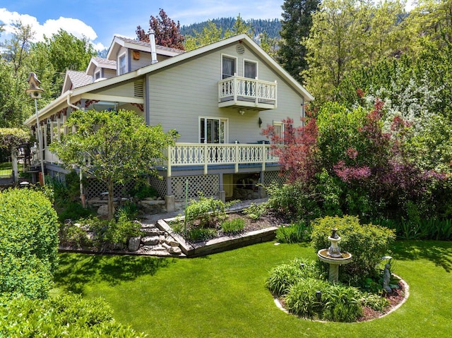 182 Mill St, Genoa, NV 89411 - back of house with a balcony, a yard, and a wooden deck