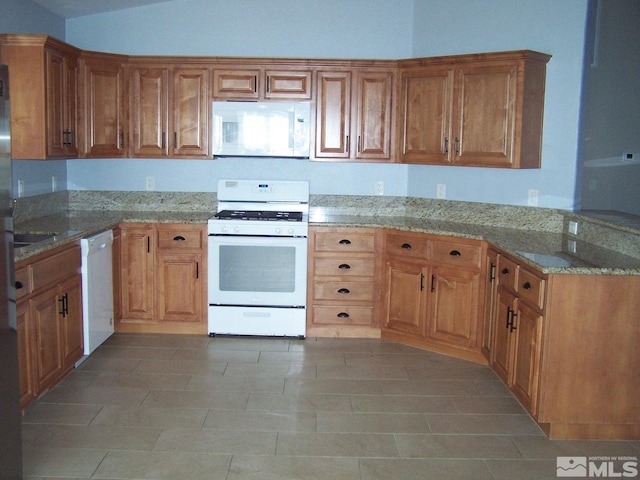 742 Megan Way, Fallon, NV 89406 - kitchen with white appliances, light stone countertops, and a peninsula