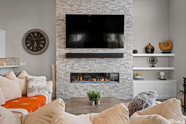 living room featuring a fireplace