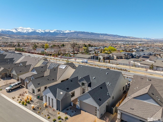 aerial view of residential area with mountains