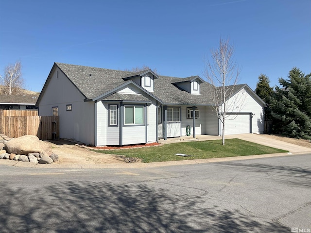 view of front of property with a garage, concrete driveway, a porch, and roof with shingles
