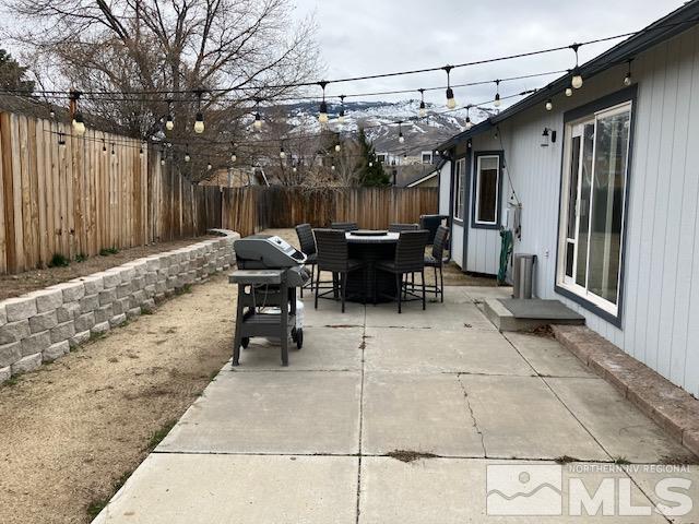 view of patio featuring a fenced backyard and outdoor dining space