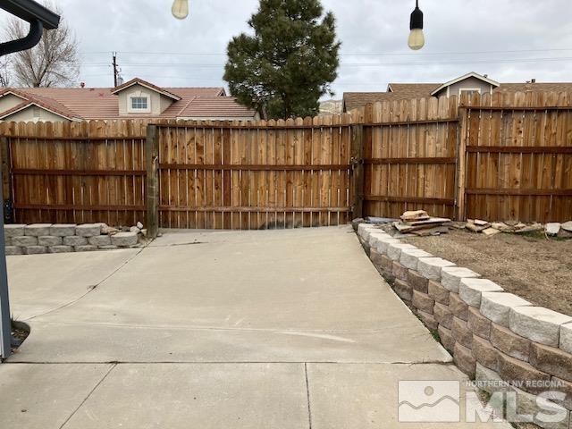 view of patio / terrace featuring fence