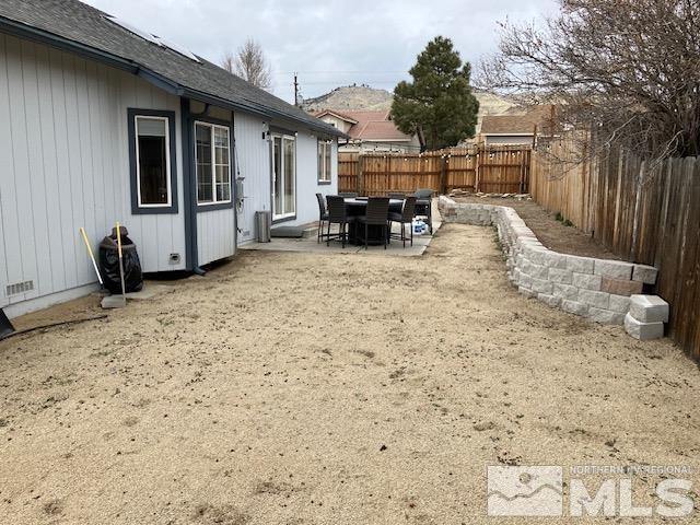 fenced backyard featuring a patio area