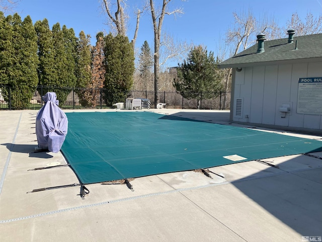 view of pool with fence and a patio