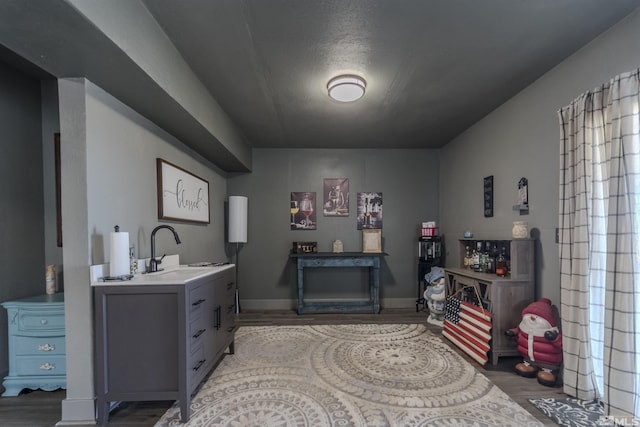 1875 View Ct, Fernley, NV 89408 - bedroom featuring a sink, light wood-style flooring, multiple windows, and baseboards