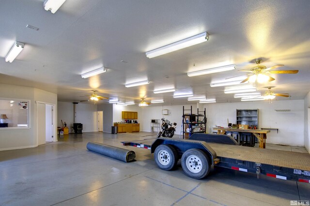1875 View Ct, Fernley, NV 89408 - garage featuring a workshop area and a ceiling fan