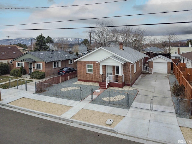 435 14th St, Sparks, NV 89431 - view of front of house featuring brick siding, concrete driveway, a fenced front yard, and a gate