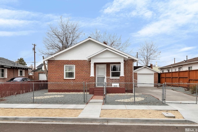 435 14th St, Sparks, NV 89431 - bungalow featuring a detached garage, brick siding, a fenced front yard, an outdoor structure, and a gate